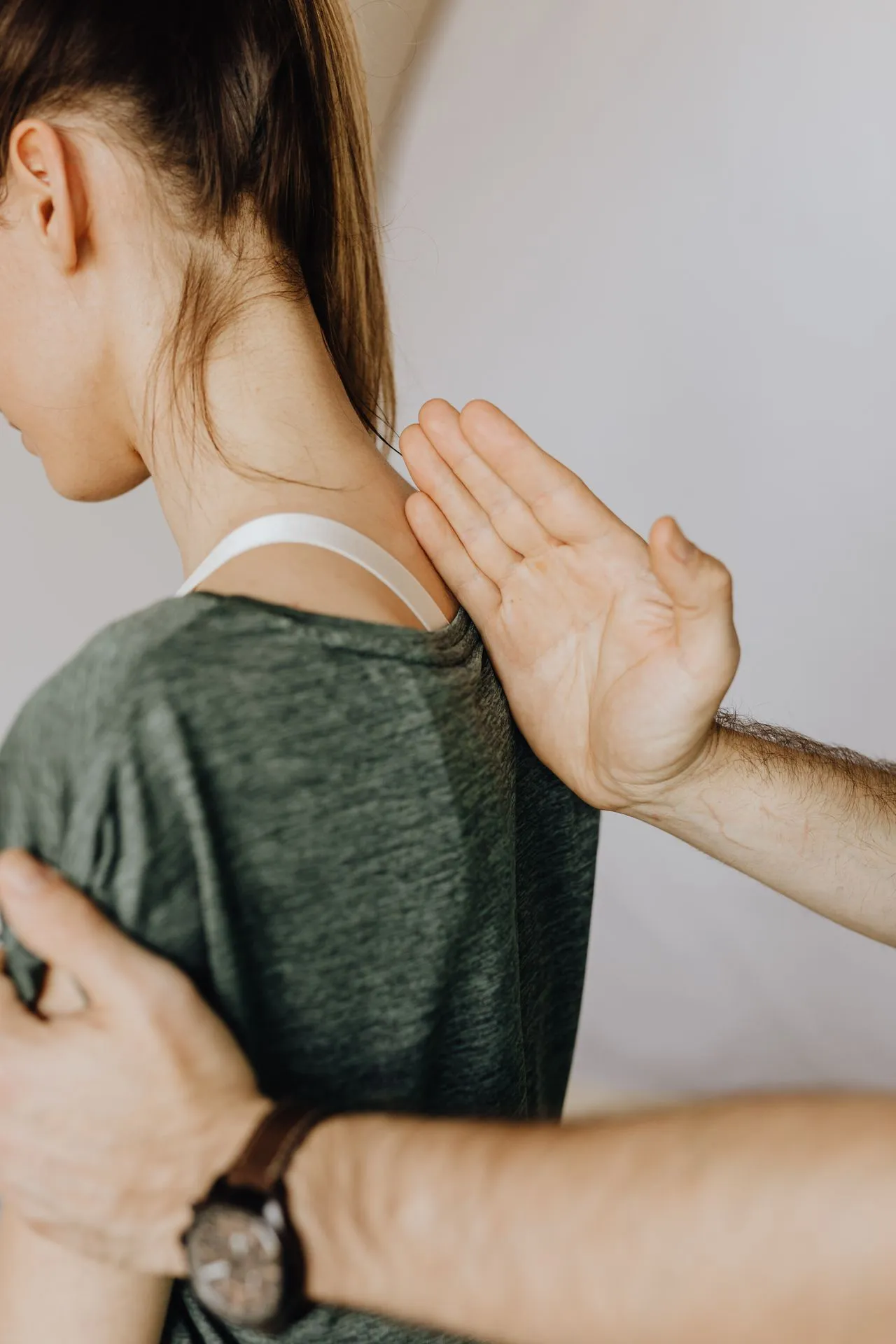 Dr Anton assessing a patient for neck pain relief in Bondi Junction